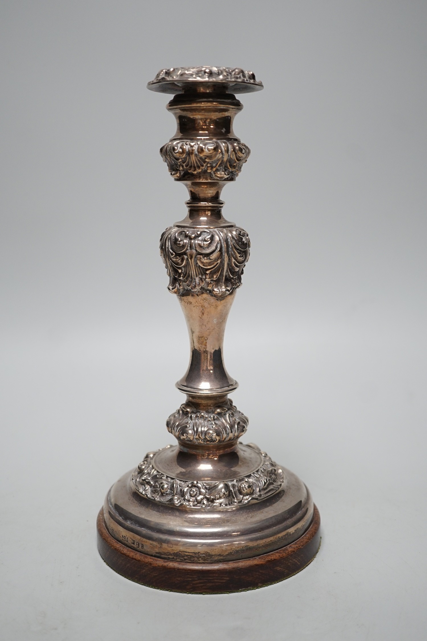 A George IV silver candlestick, Thomas Blagden & Co, Sheffield, 1822, now mounted on a later wooden base, with drill hole for electricity??, overall height 26.9cm.